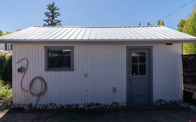 a bedroom with bed and a window