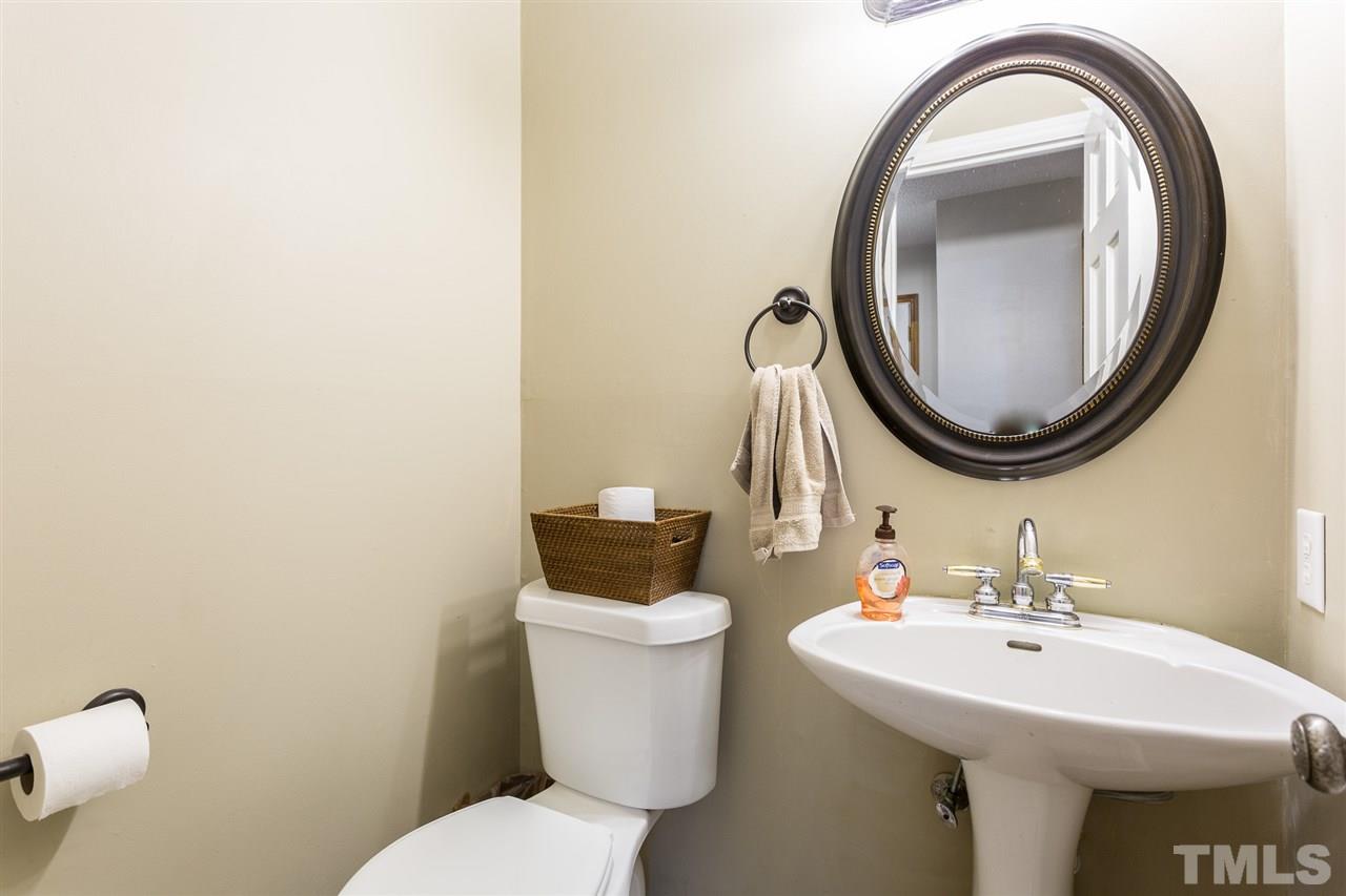 7613 Leesville Road Raleigh, NC 27613 - Photo 19 of 30 a bathroom with a sink and a mirror