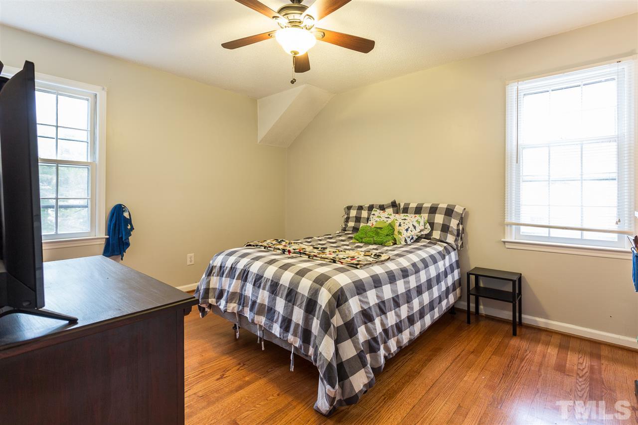 7613 Leesville Road Raleigh, NC 27613 - Photo 23 of 30 a bedroom with a bed and a window