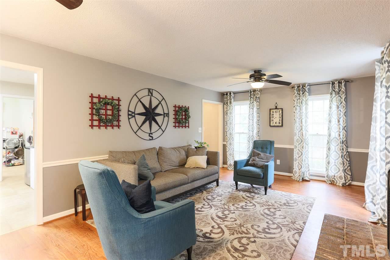 7613 Leesville Road Raleigh, NC 27613 - Photo 7 of 30 a living room with furniture and a window