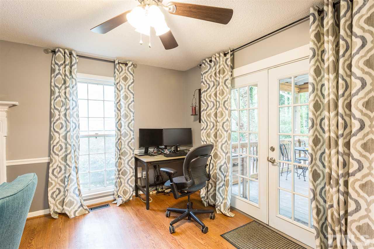 7613 Leesville Road Raleigh, NC 27613 - Photo 9 of 30 a view of a workspace with furniture and a window