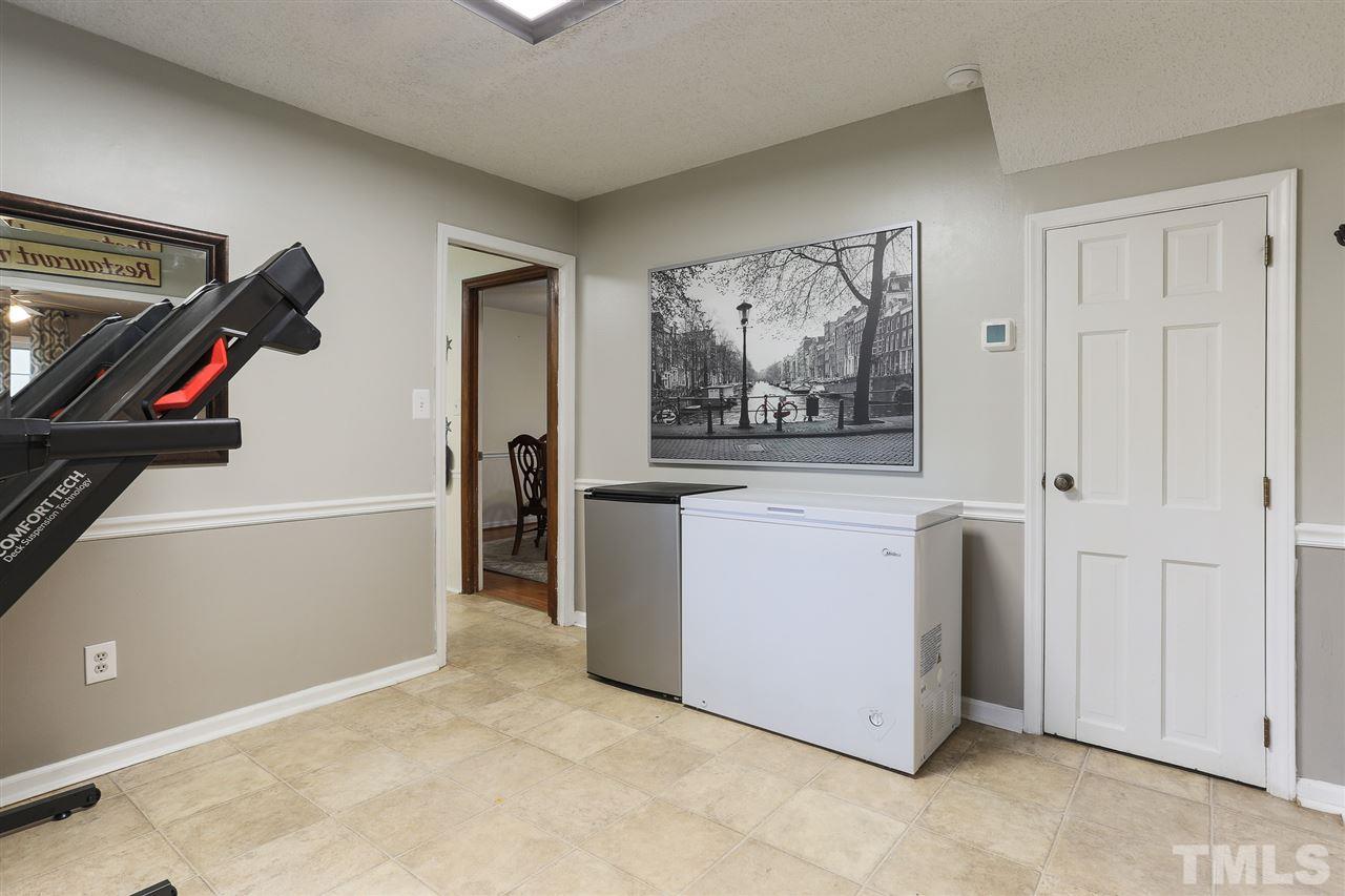 7613 Leesville Road Raleigh, NC 27613 - Photo 10 of 30 a view of a hallway with washer and dryer