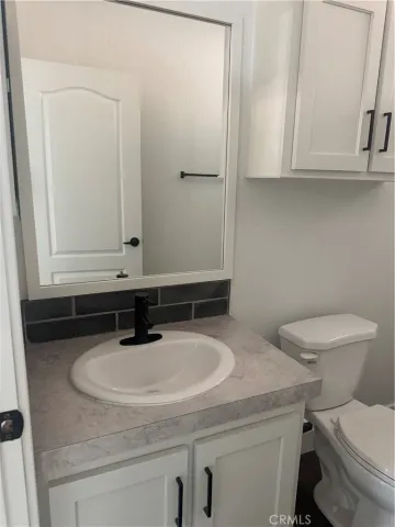 a bathroom with a sink and a toilet