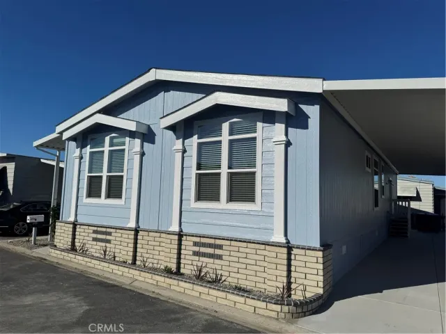a front view of a house with many windows