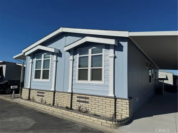 a front view of a house with many windows