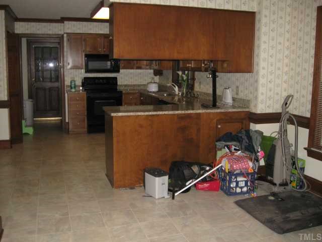 11001 Coachmans Way Raleigh, NC 27614 - Photo 4 of 8 a room with storage and utility