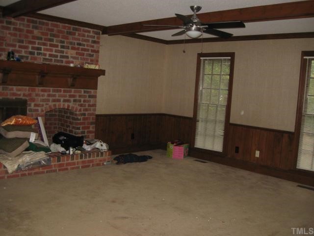 11001 Coachmans Way Raleigh, NC 27614 - Photo 7 of 8 a room with a fireplace and a table