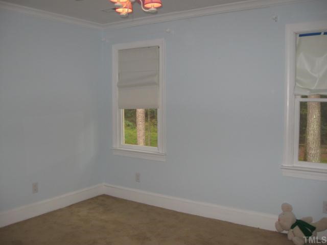 11001 Coachmans Way Raleigh, NC 27614 - Photo 8 of 8 an empty room with windows