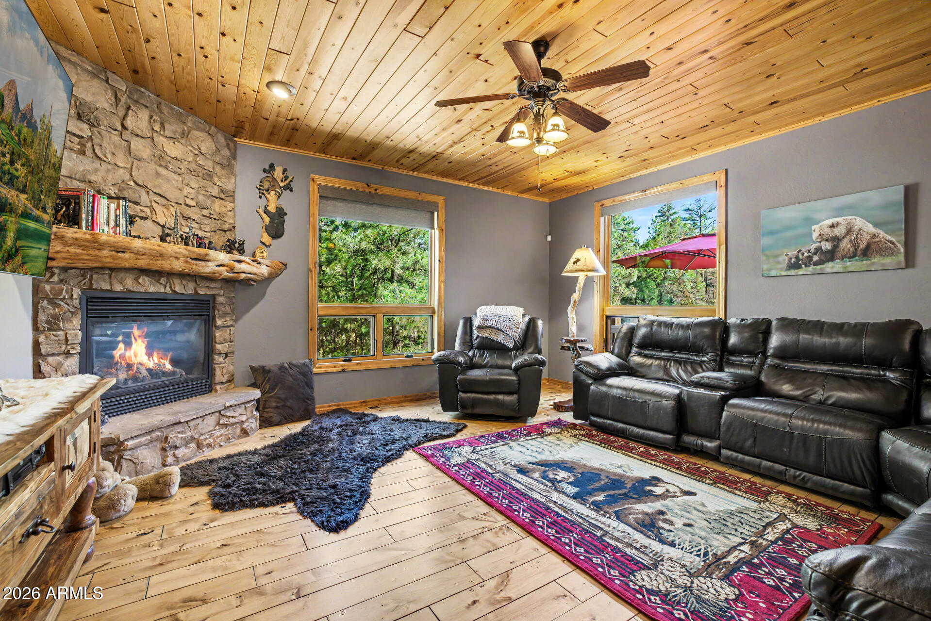 1681 South Jimson Loop Show Low, AZ 85901 - Photo 22 of 105 a living room with furniture and a fireplace