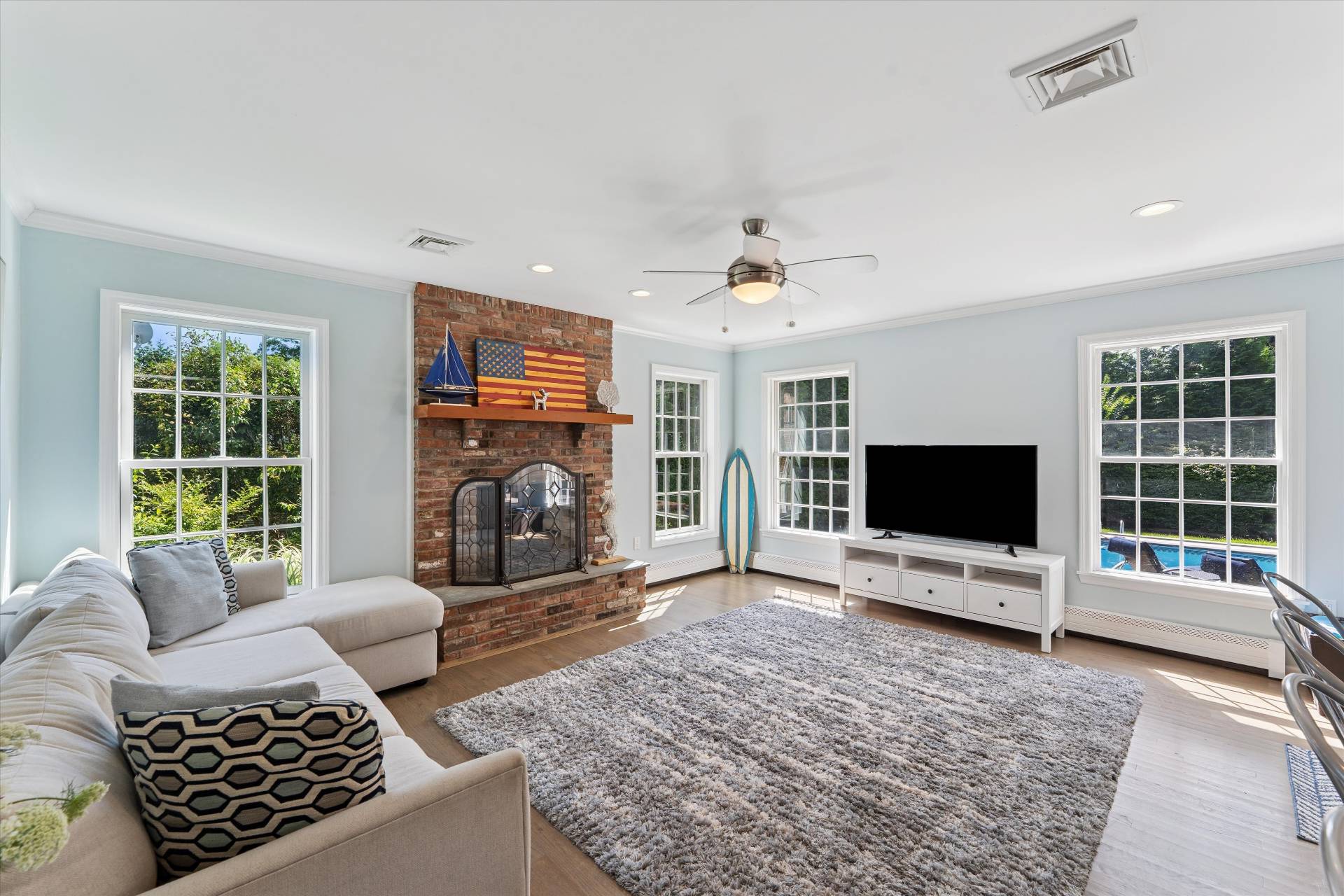 19 Maple Street Westhampton Beach, NY 11978 - Photo 9 of 23 a living room with furniture and a flat screen tv