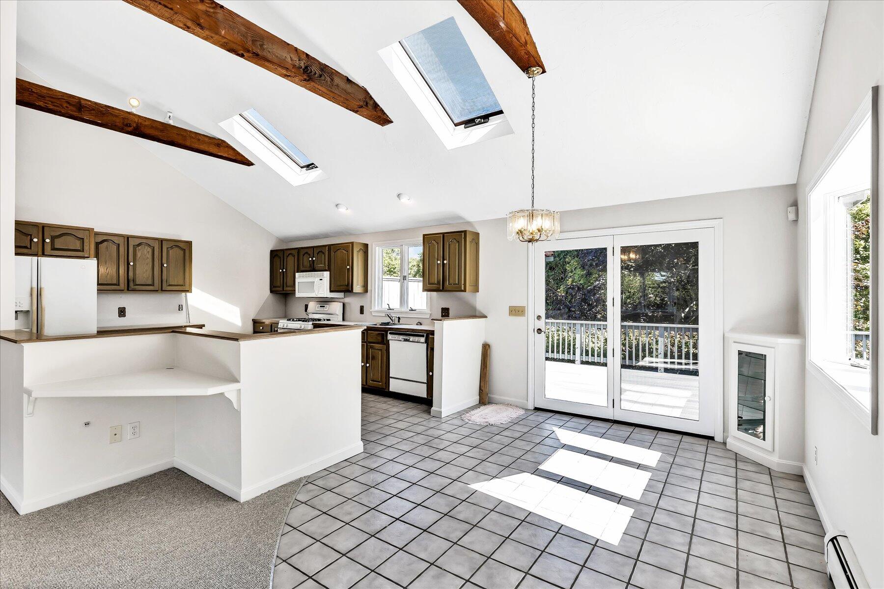 19 Mashnee Road Bourne, MA 02532 - Photo 13 of 46 a large white kitchen with cabinets