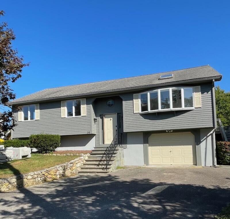 19 Mashnee Road Bourne, MA 02532 - Photo 2 of 46 a front view of a house with a yard