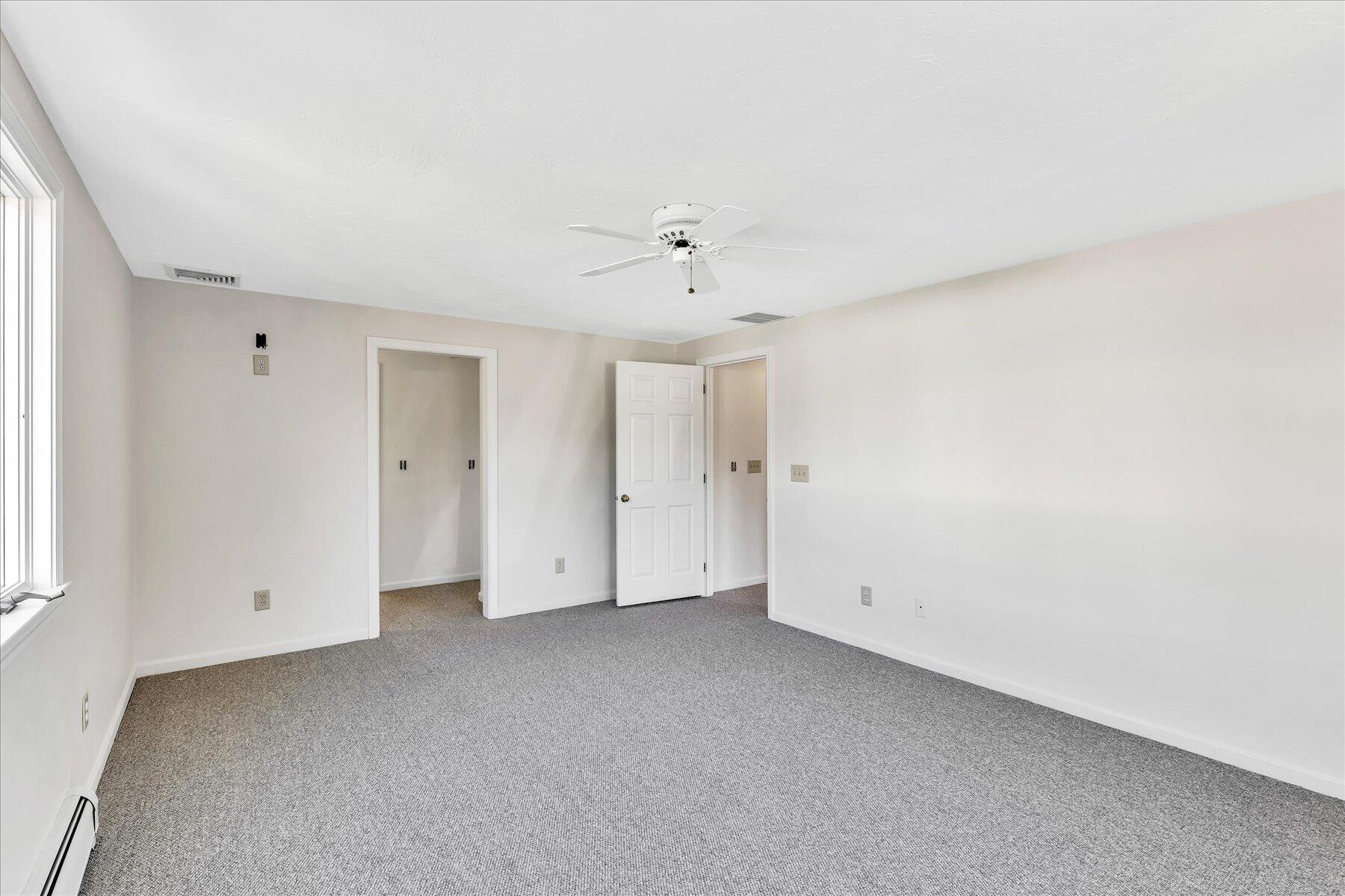 19 Mashnee Road Bourne, MA 02532 - Photo 26 of 46 an empty room with a ceiling fan and window