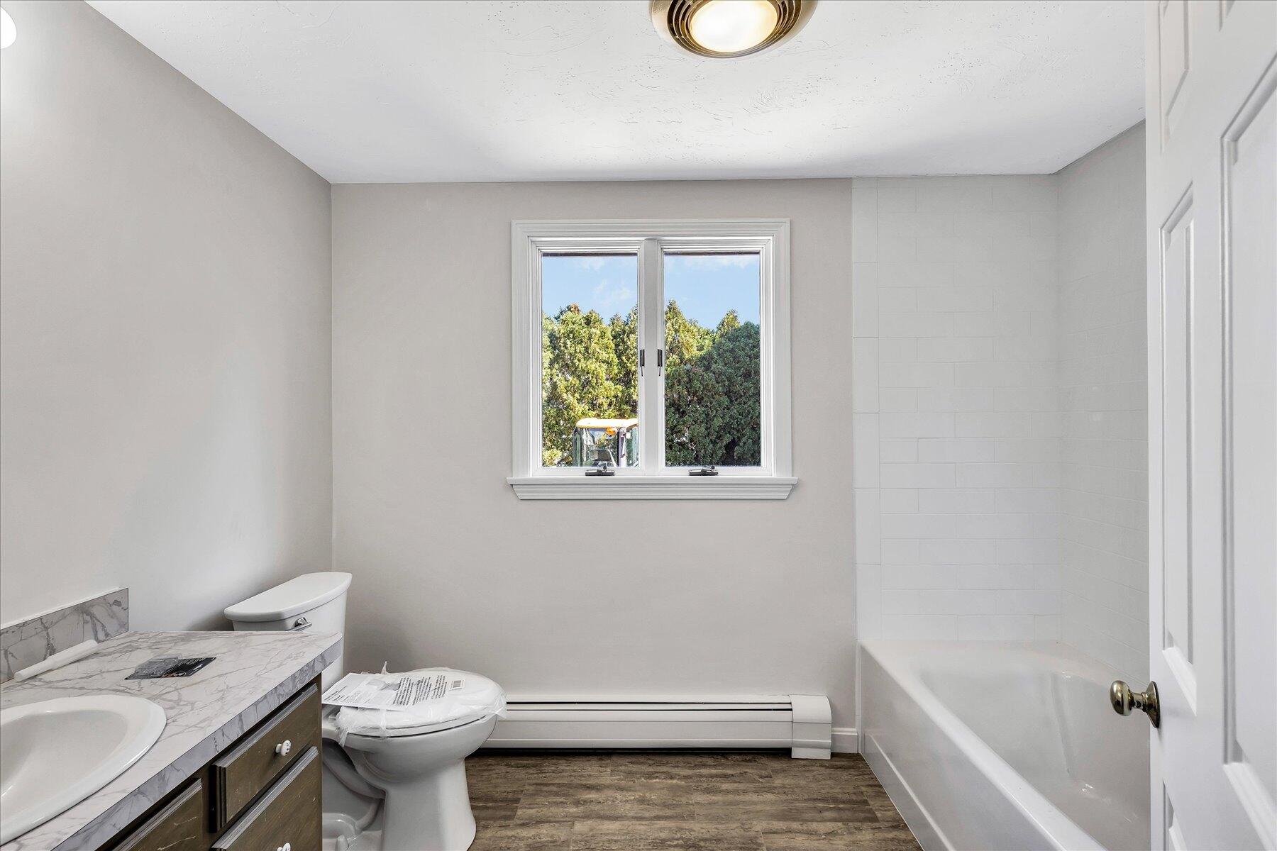 19 Mashnee Road Bourne, MA 02532 - Photo 31 of 46 a bathroom with a sink a toilet and tub