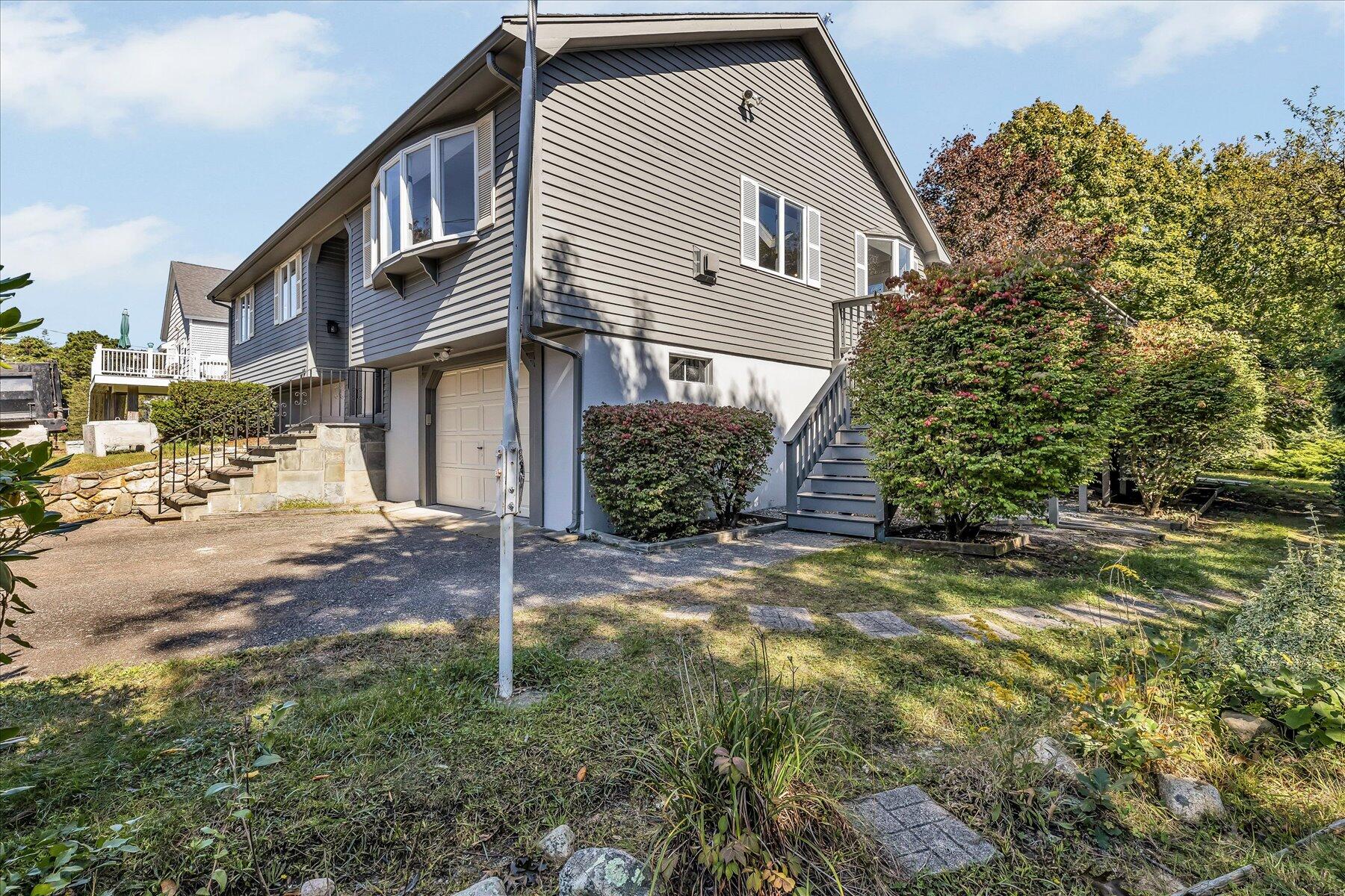 19 Mashnee Road Bourne, MA 02532 - Photo 36 of 46 a view of a house with a yard