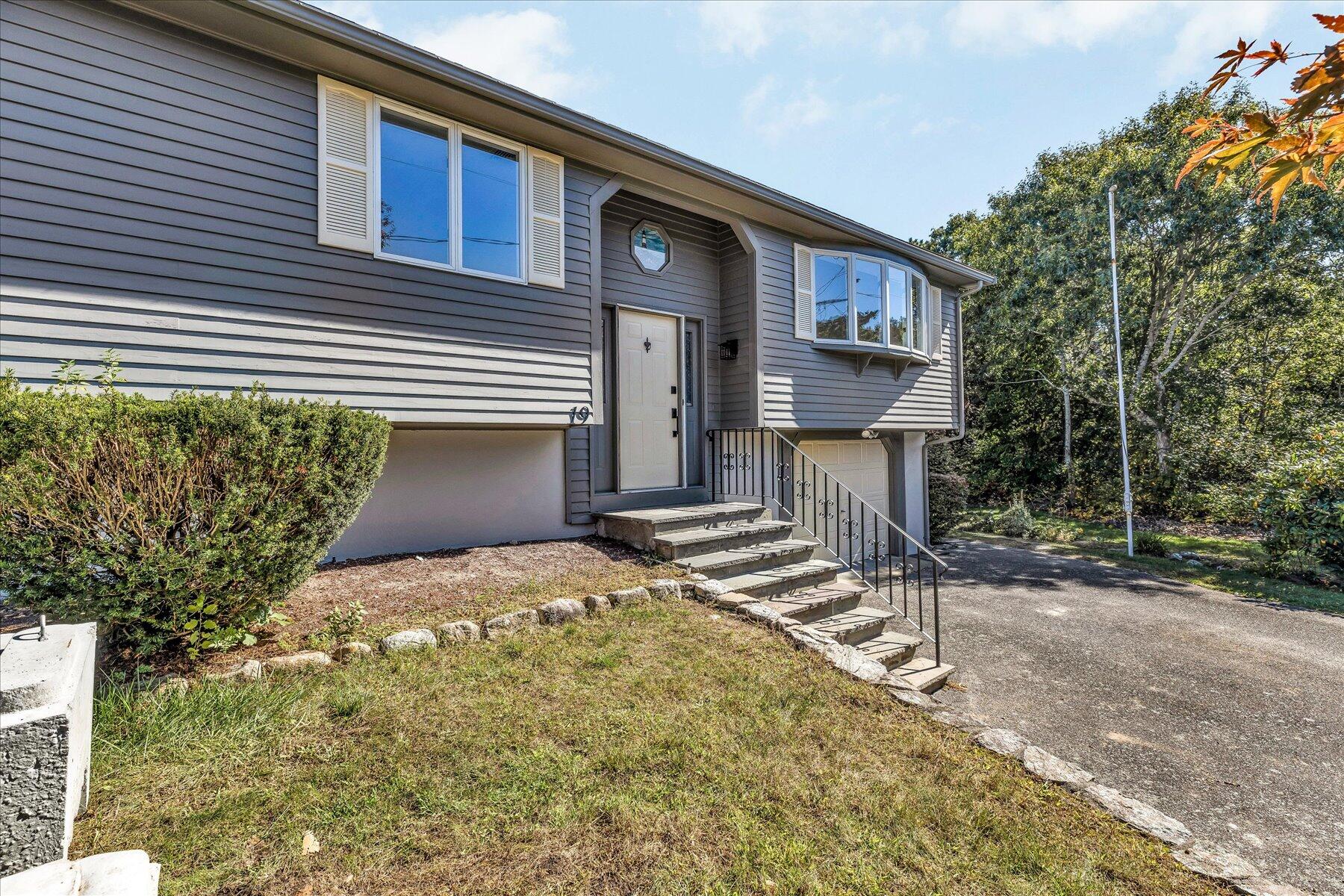 19 Mashnee Road Bourne, MA 02532 - Photo 38 of 46 a front view of a house with a yard