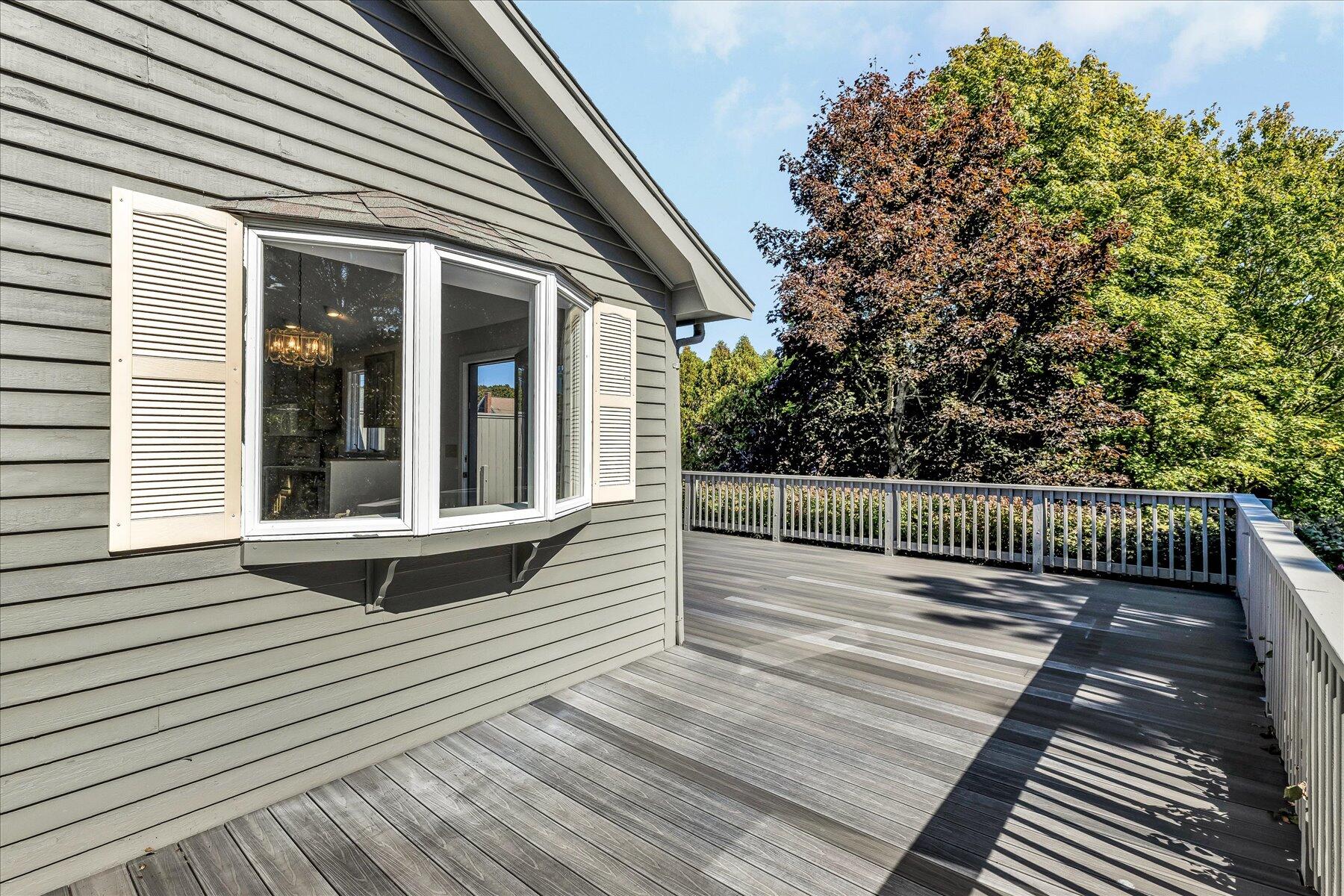 19 Mashnee Road Bourne, MA 02532 - Photo 40 of 46 a view of deck with wooden floor and fence next to a yard