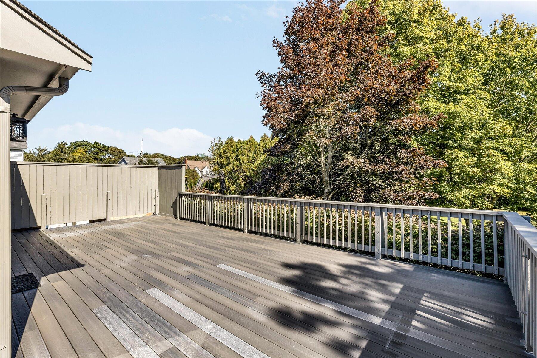 19 Mashnee Road Bourne, MA 02532 - Photo 41 of 46 a view of balcony with wooden floor and lake view