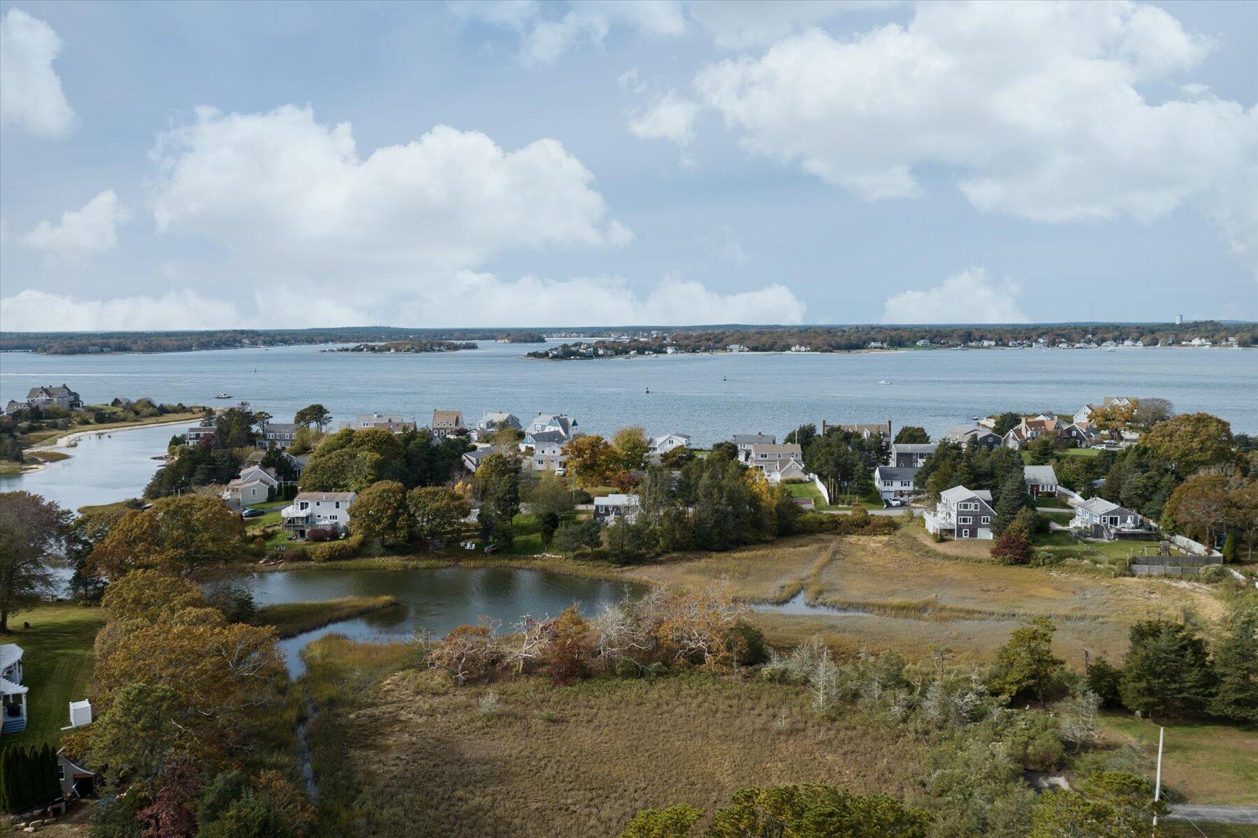 19 Mashnee Road Bourne, MA 02532 - Photo 43 of 46 a view of a lake from a yard