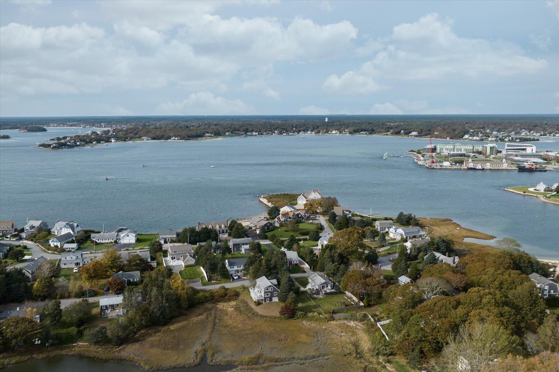 19 Mashnee Road Bourne, MA 02532 - Photo 44 of 46 a view of a lake with lawn chairs