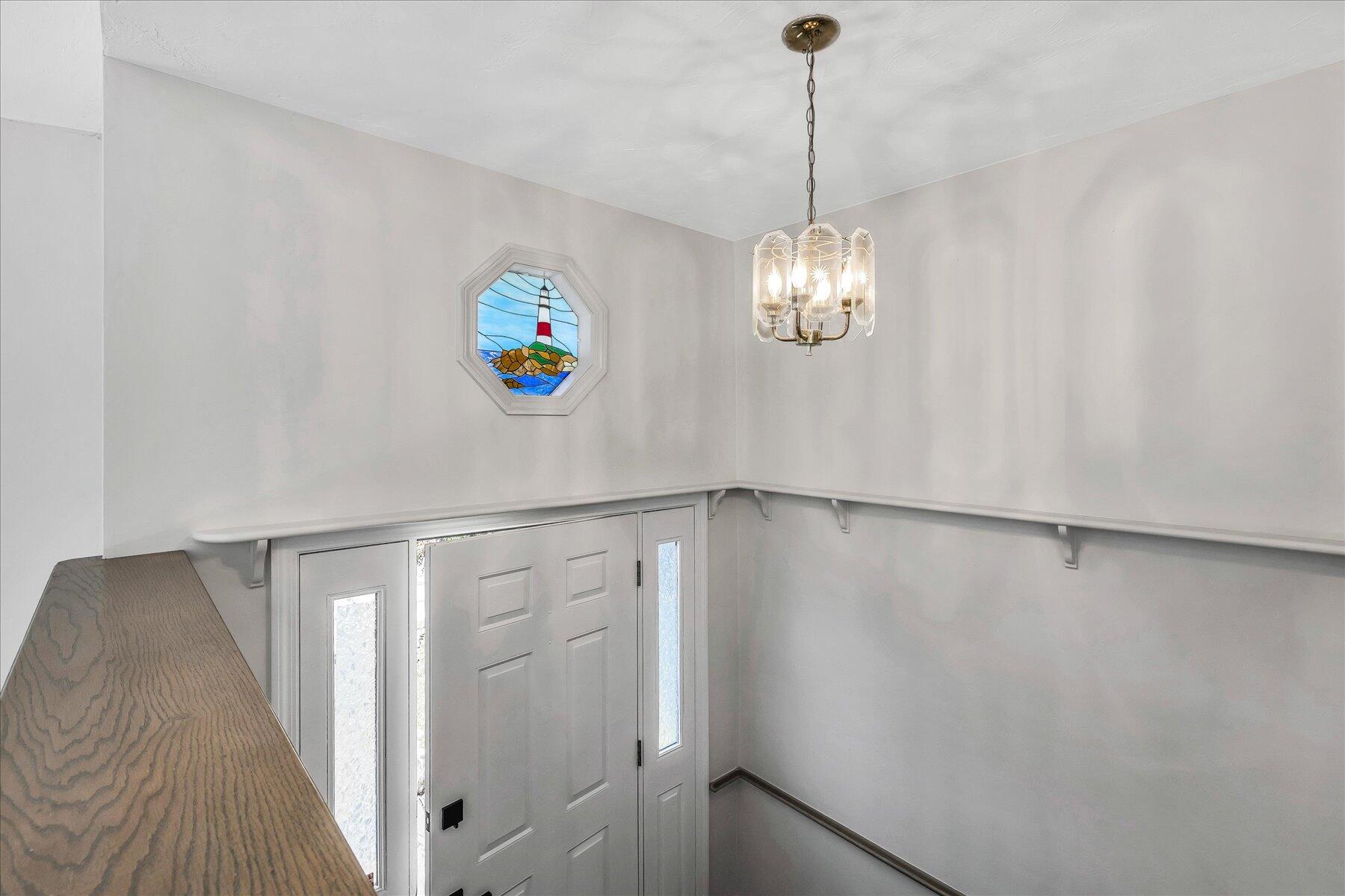 19 Mashnee Road Bourne, MA 02532 - Photo 5 of 46 a view of a hallway with a chandelier fan