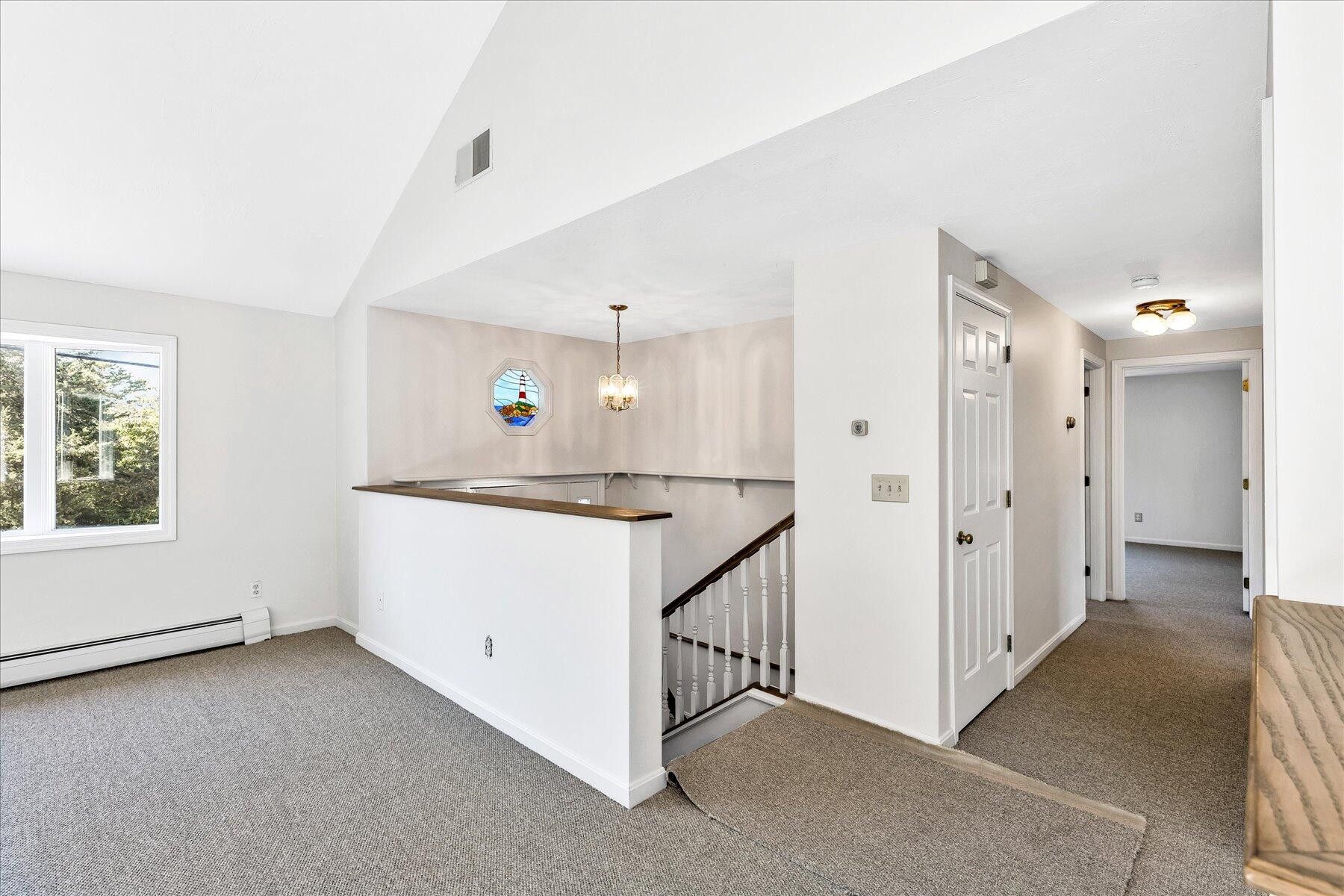 19 Mashnee Road Bourne, MA 02532 - Photo 7 of 46 a view of kitchen and hall with wooden floor