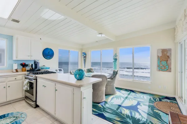 a kitchen with sink cabinets and window