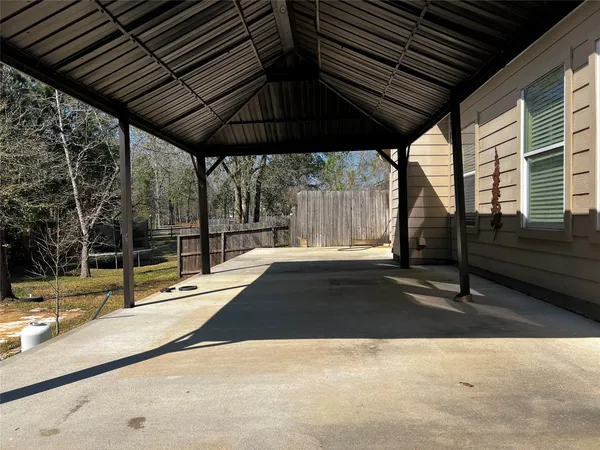 a view of swimming pool with sitting area