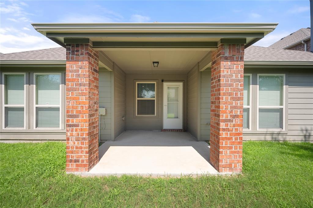 520 Rustic Oak Lane McKinney, TX 75072 - Photo 28 of 30 Covered patio featuring brick columns, a concrete slab, and a ceiling-mounted light fixture