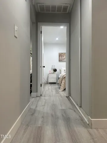 a view of a livingroom and a hallway