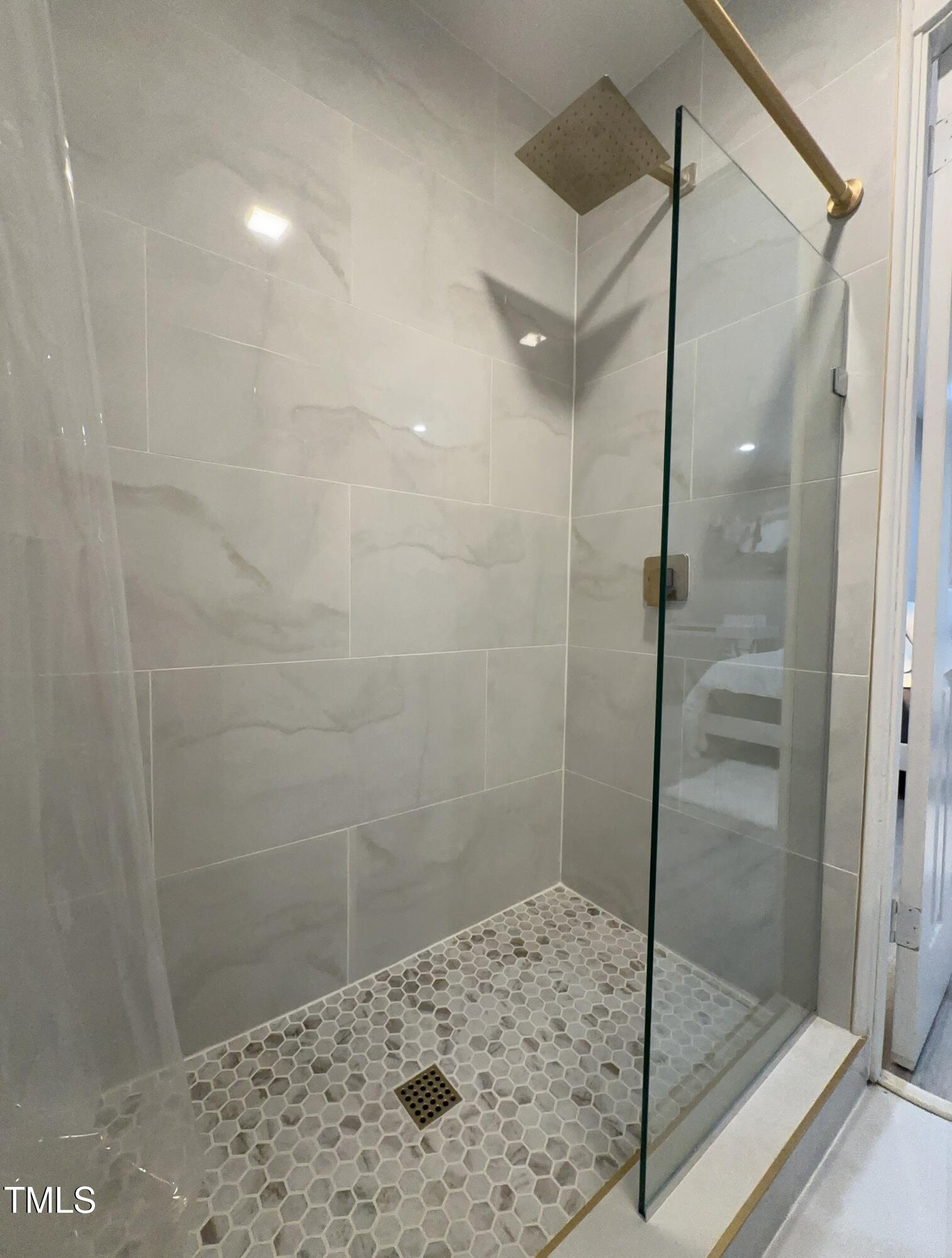 1216 Elizabeth Road West Wilson, NC 27893 - Photo 19 of 34 a bathroom with a shower and a glass door