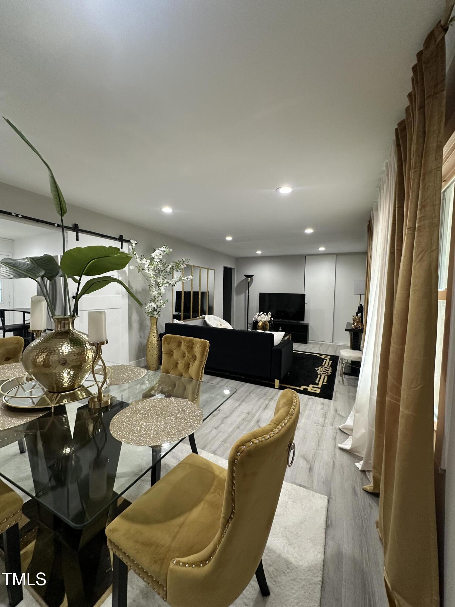 1216 Elizabeth Road West Wilson, NC 27893 - Photo 21 of 34 a living room with furniture and a chandelier