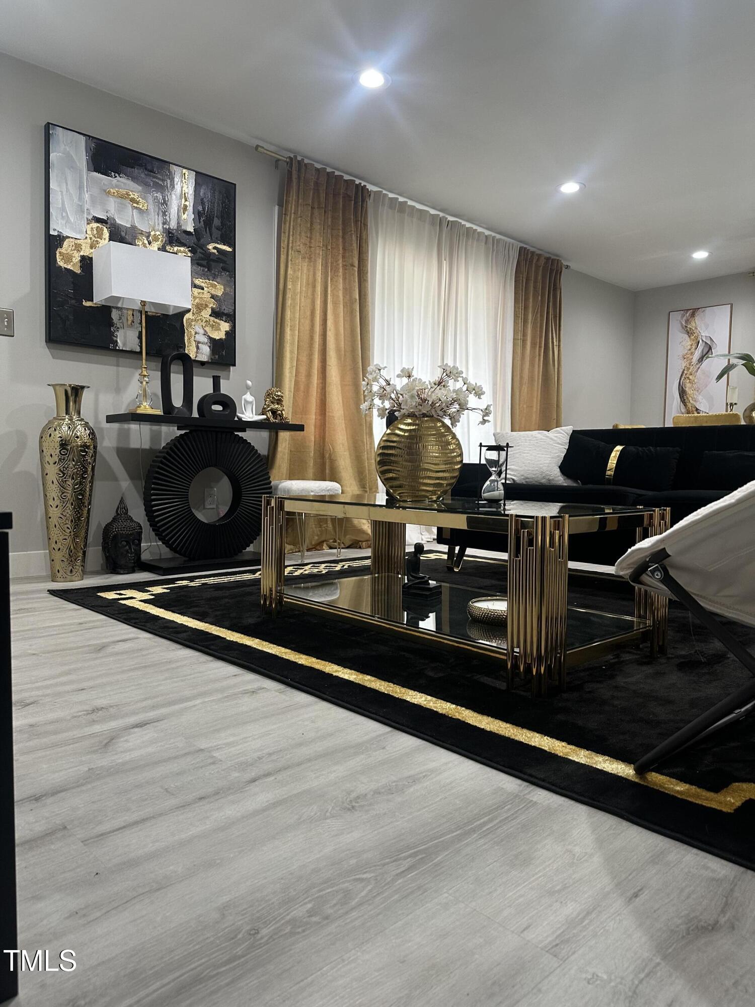 1216 Elizabeth Road West Wilson, NC 27893 - Photo 23 of 34 a living room with furniture and a flat screen tv