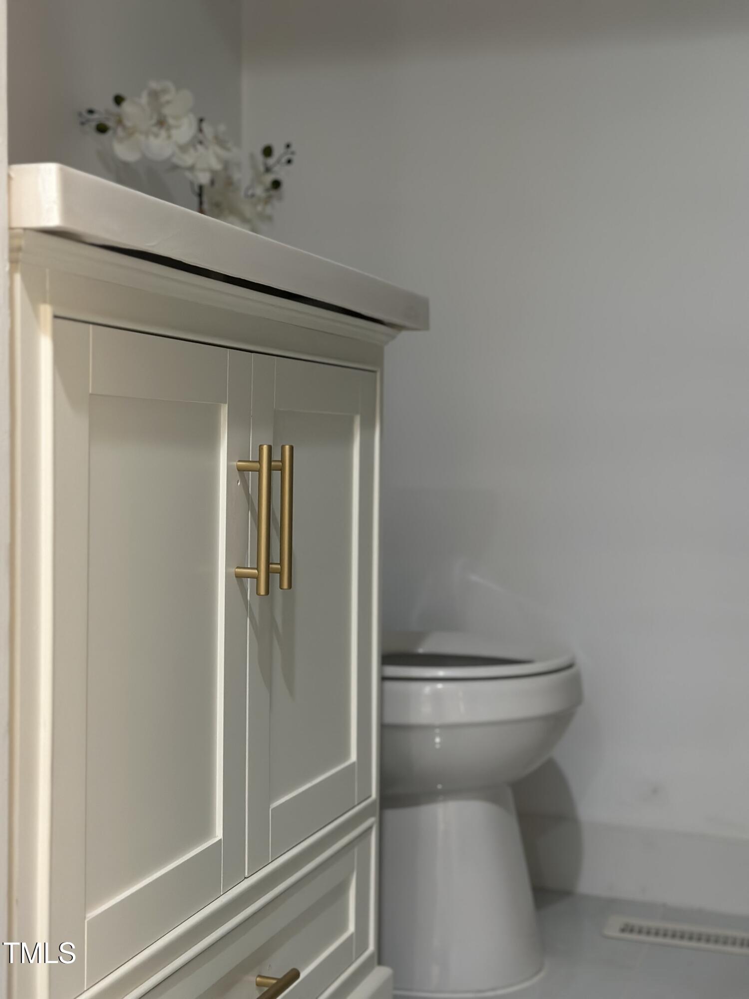 1216 Elizabeth Road West Wilson, NC 27893 - Photo 25 of 34 a bathroom with a toilet and a sink
