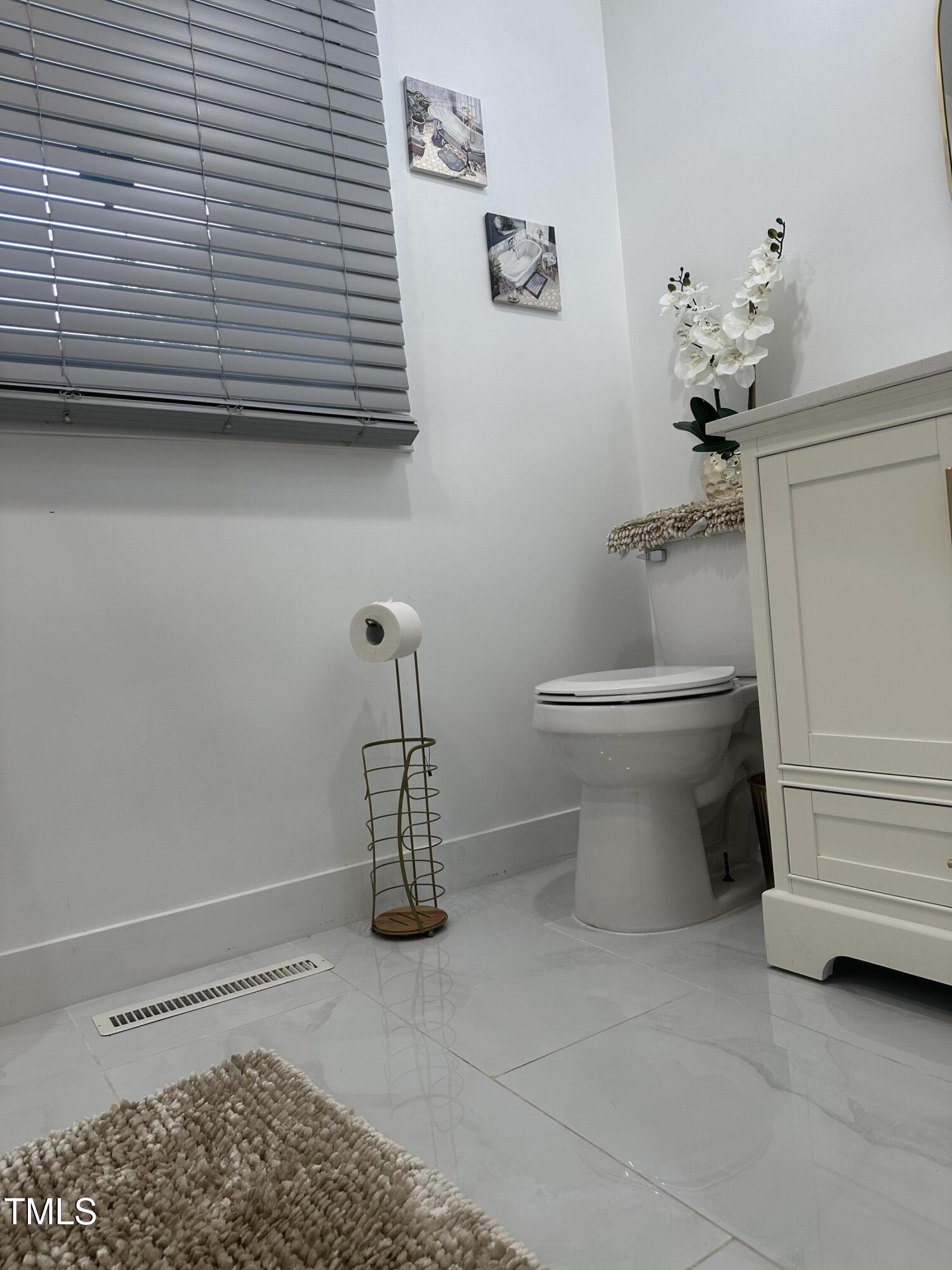 1216 Elizabeth Road West Wilson, NC 27893 - Photo 26 of 34 a bathroom with a toilet and a shower