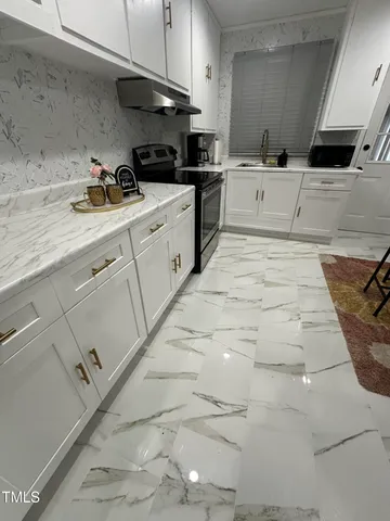 a kitchen with a sink and cabinets