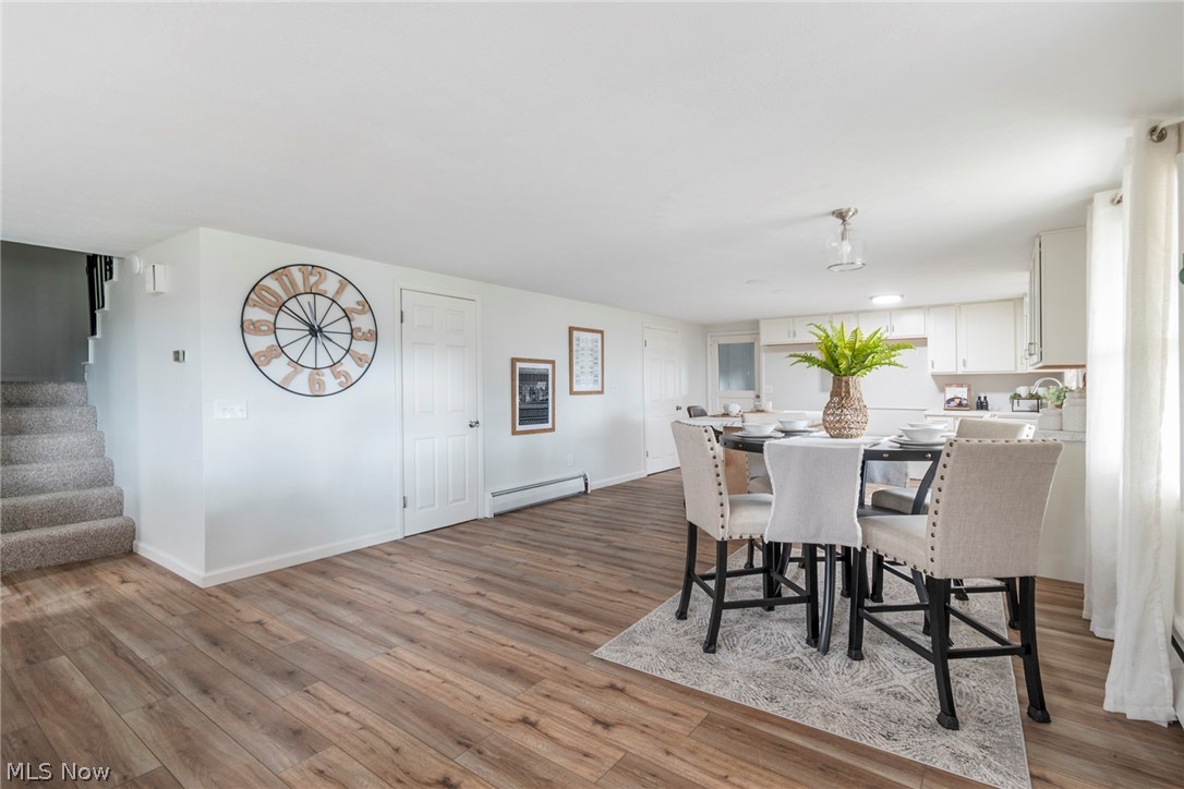 25005 West Egypt Road Minerva, OH 44657 - Photo 12 of 33 Dining space with a baseboard heating unit and light hardwood / wood-style flooring