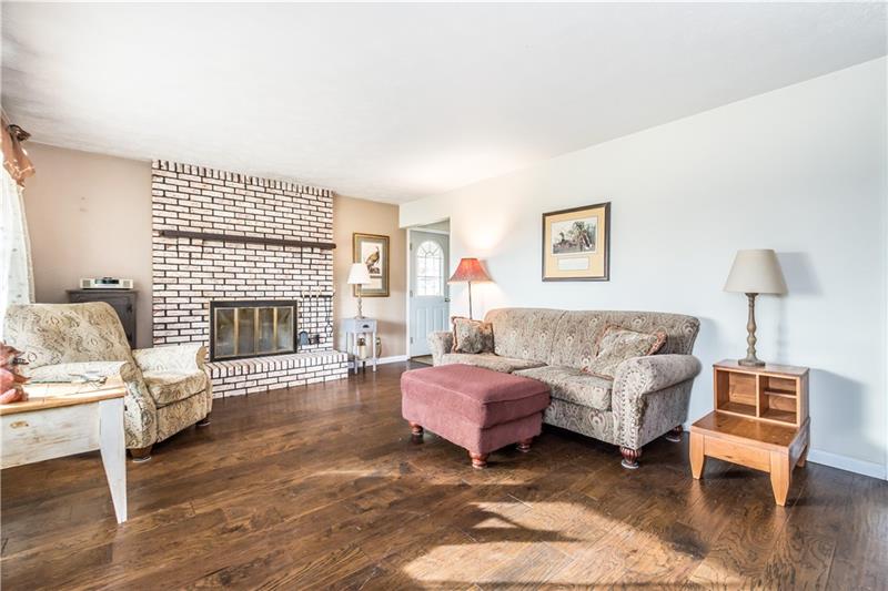 207 Steiner Bridge Road Valencia, PA 16059 - Photo 6 of 24 Wood burning fireplace in living room