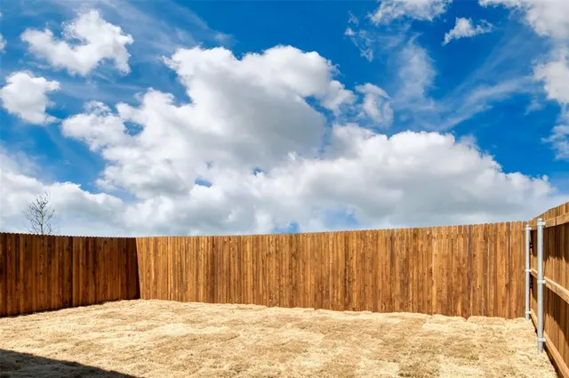 a view of a pathway with a yard