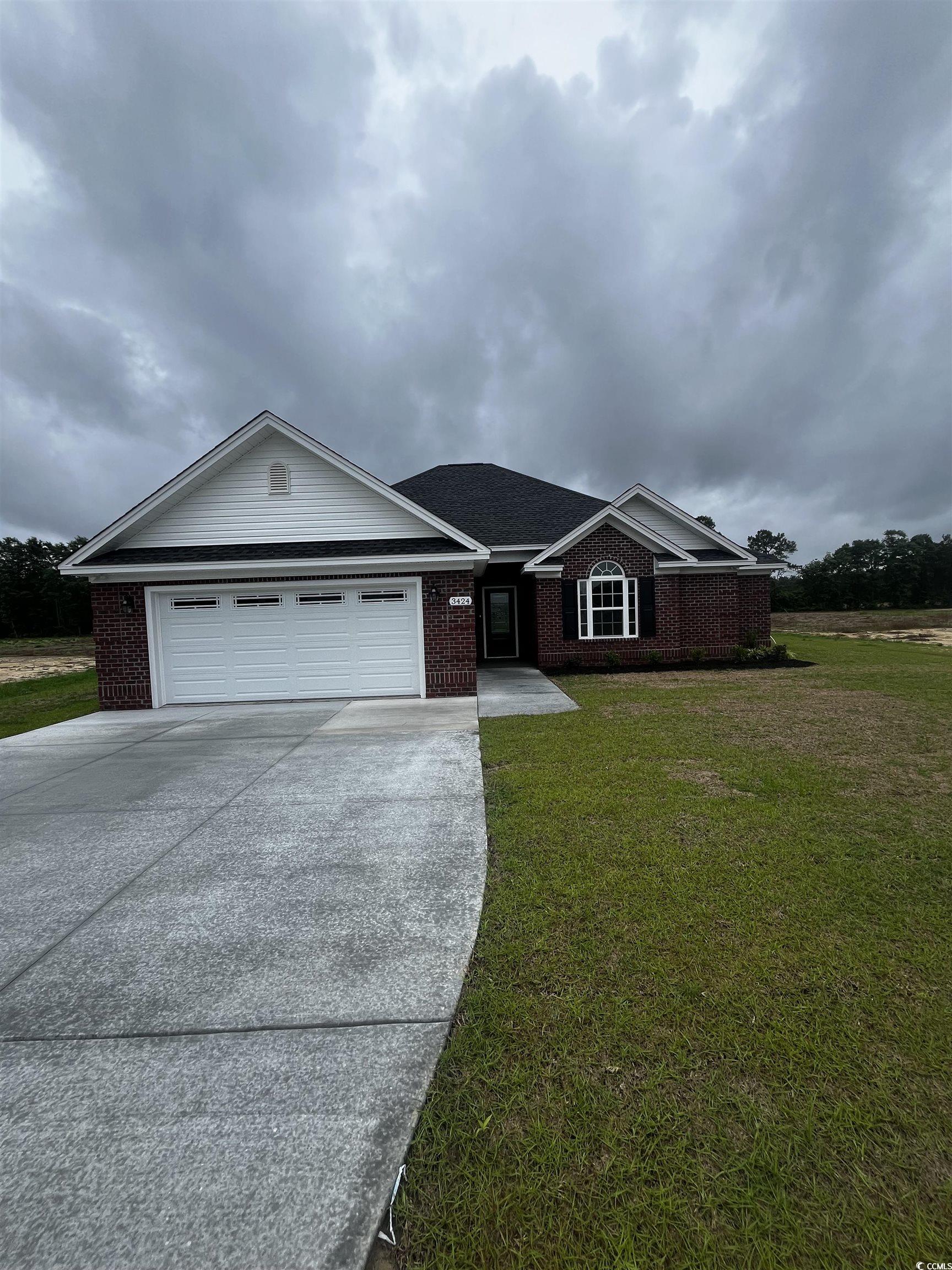 3424 Asbury Road Aynor, SC 29511 - Photo 1 of 10 Ranch-style home with driveway, brick siding, a ga