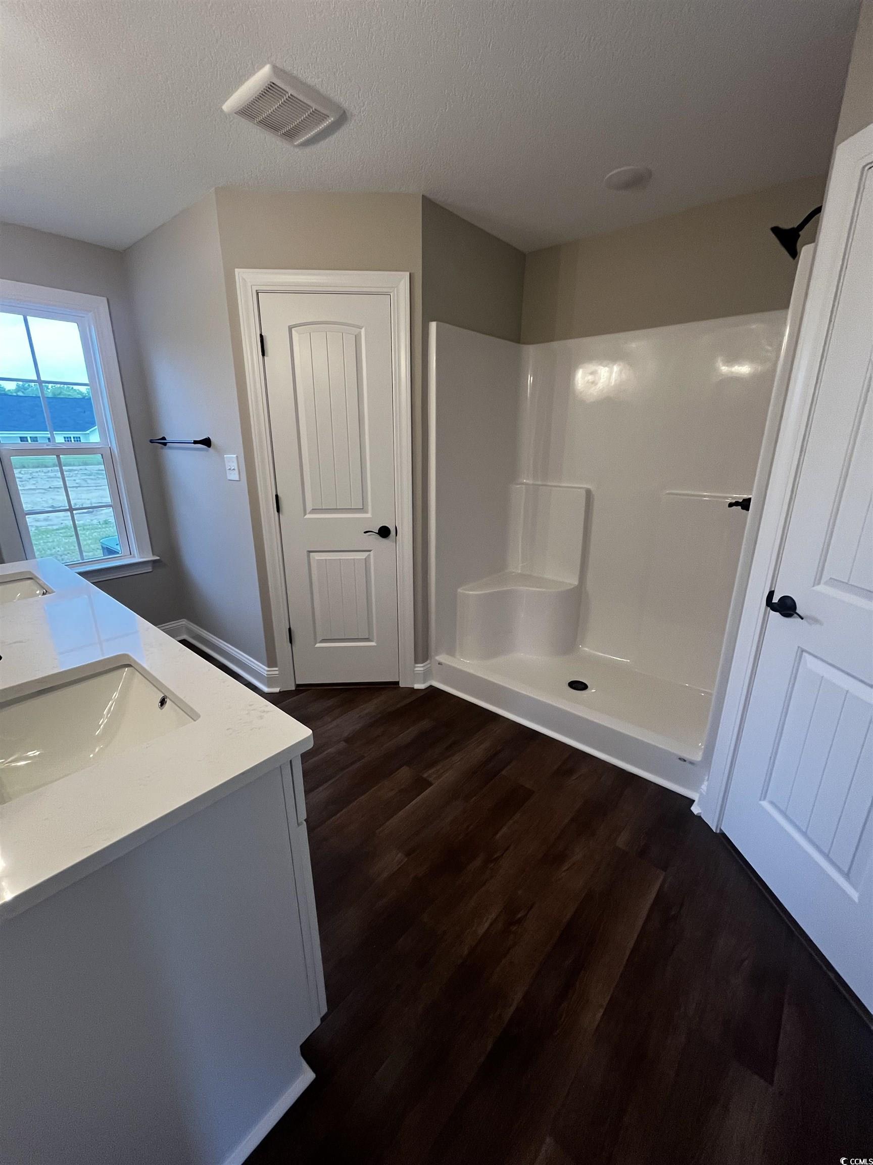 3424 Asbury Road Aynor, SC 29511 - Photo 9 of 10 Bathroom with walk in shower, wood finished floors