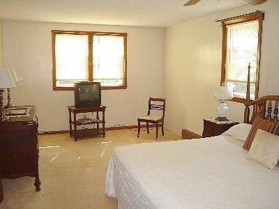 67 Inman Road, Unit F Dennis Port, MA 02639 - Photo 11 of 11 a bedroom with a bed and a desk