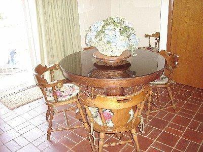 67 Inman Road, Unit F Dennis Port, MA 02639 - Photo 5 of 11 a view of a dining room with table and chairs