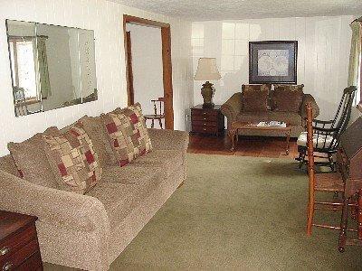 67 Inman Road, Unit F Dennis Port, MA 02639 - Photo 6 of 11 a living room with furniture and a window