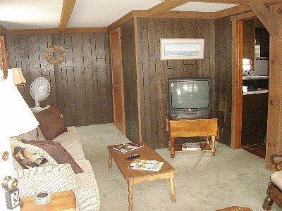 67 Inman Road, Unit F Dennis Port, MA 02639 - Photo 7 of 11 a bedroom with a bed and a mirror