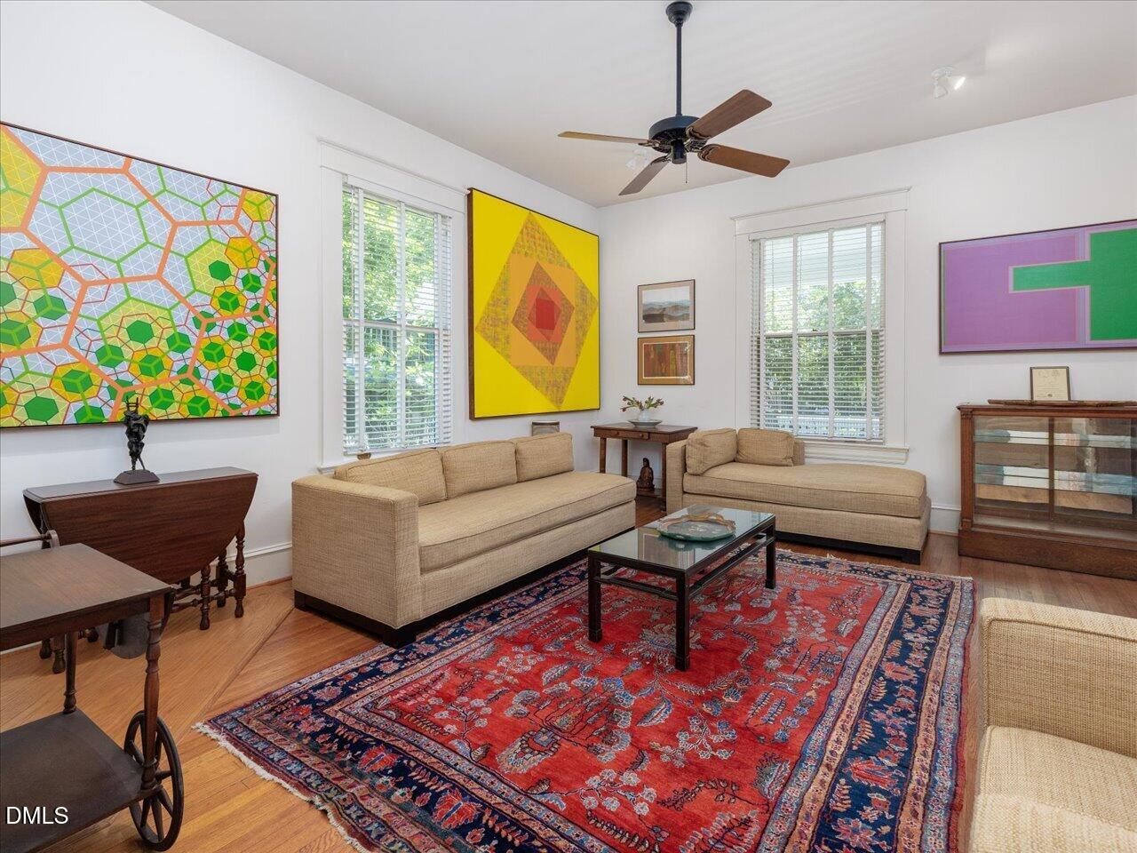 215 Hillcrest Road Raleigh, NC 27605 - Photo 28 of 97 a living room with fireplace furniture and a window