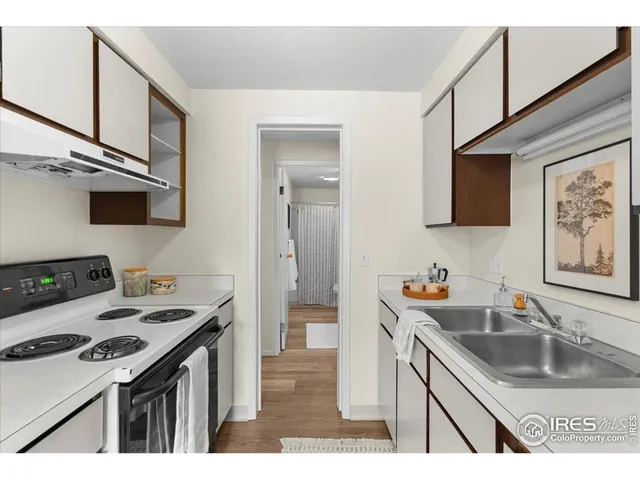 a kitchen with a stove and a refrigerator