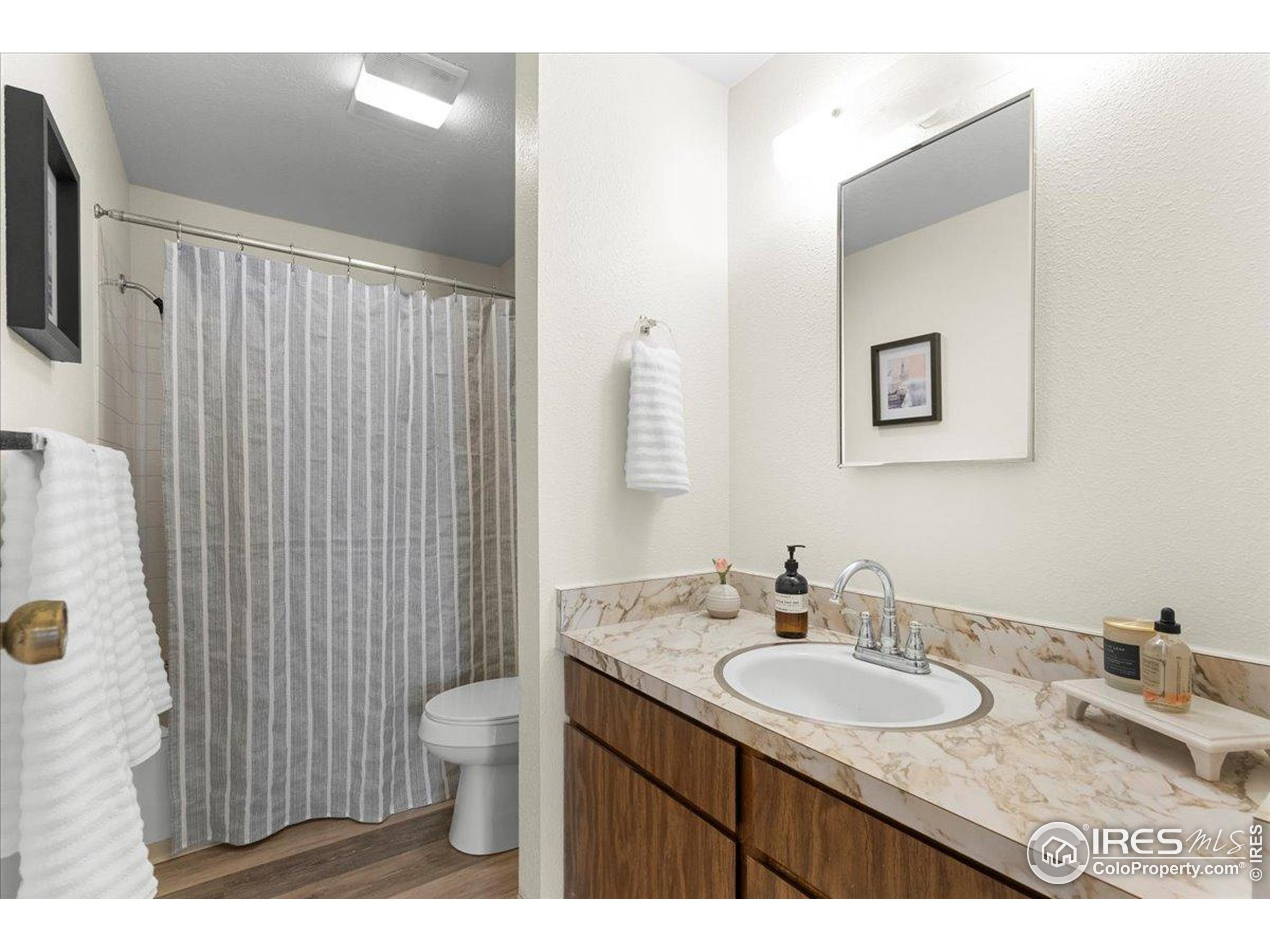 1204 Pomona Street, Unit S & T Fort Collins, CO 80521 - Photo 18 of 40 a bathroom with a granite countertop sink toilet and shower