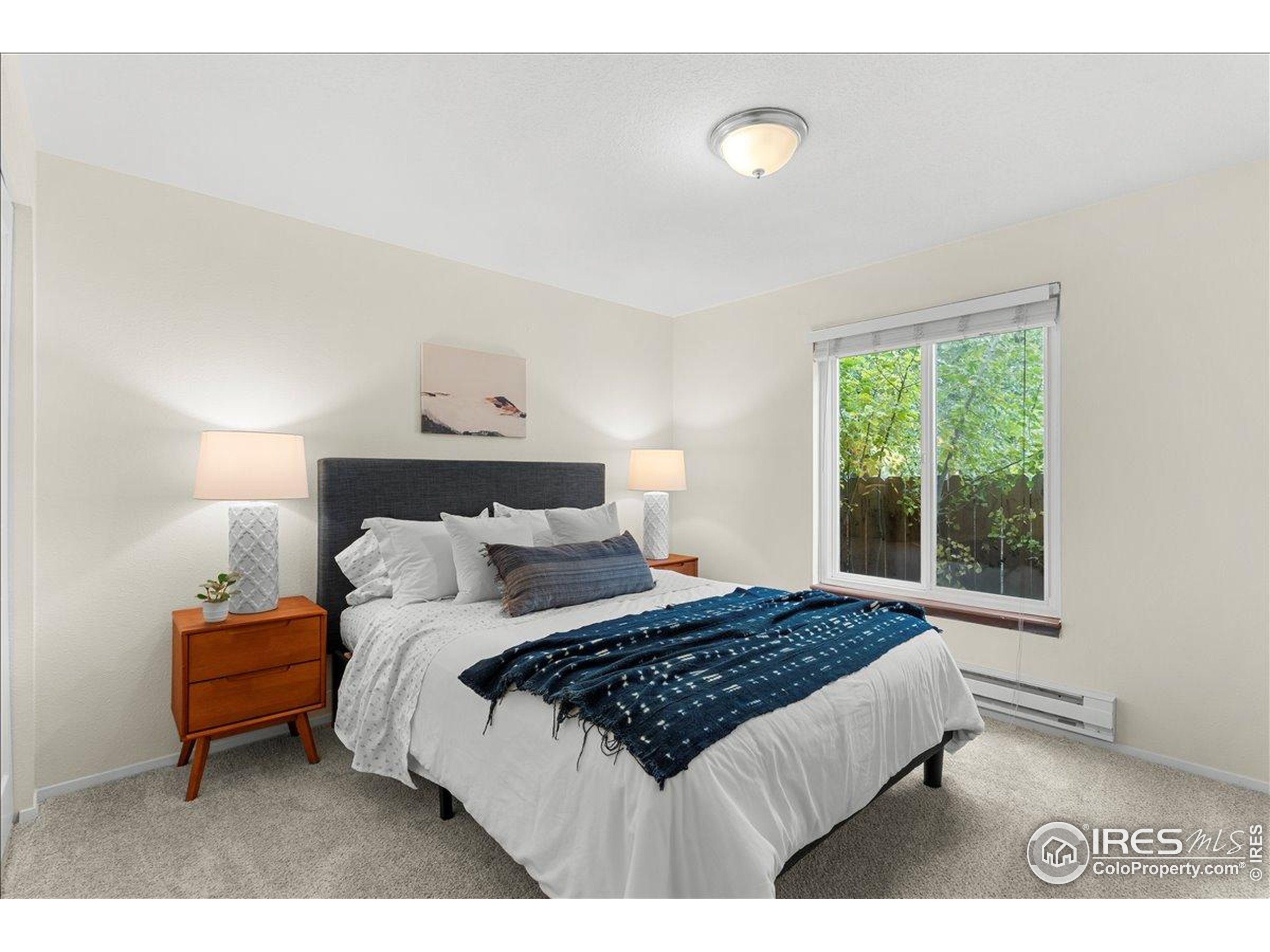 1204 Pomona Street, Unit S & T Fort Collins, CO 80521 - Photo 21 of 40 a bedroom with a bed and a window