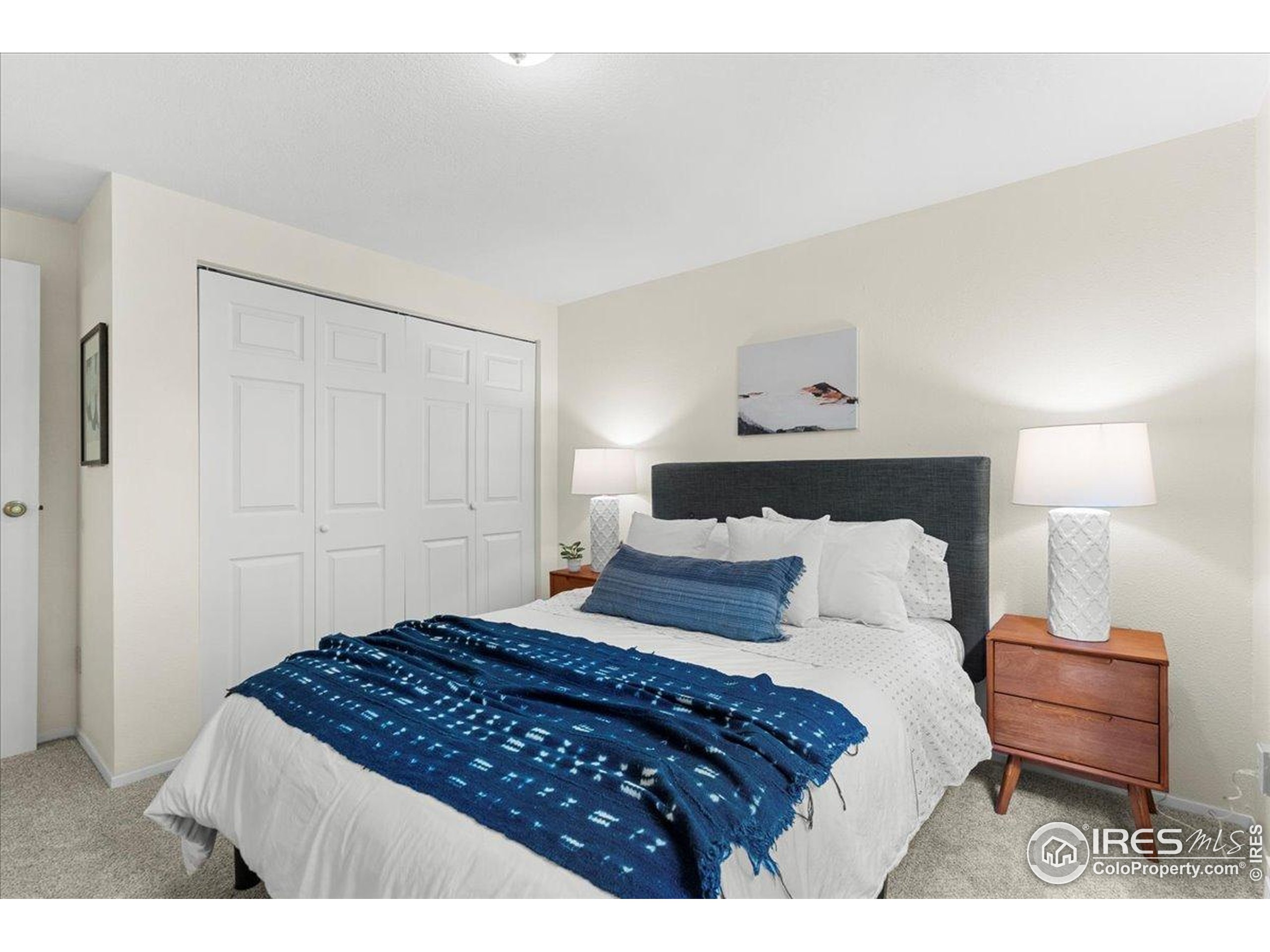 1204 Pomona Street, Unit S & T Fort Collins, CO 80521 - Photo 23 of 40 a bedroom with a bed and a night stand